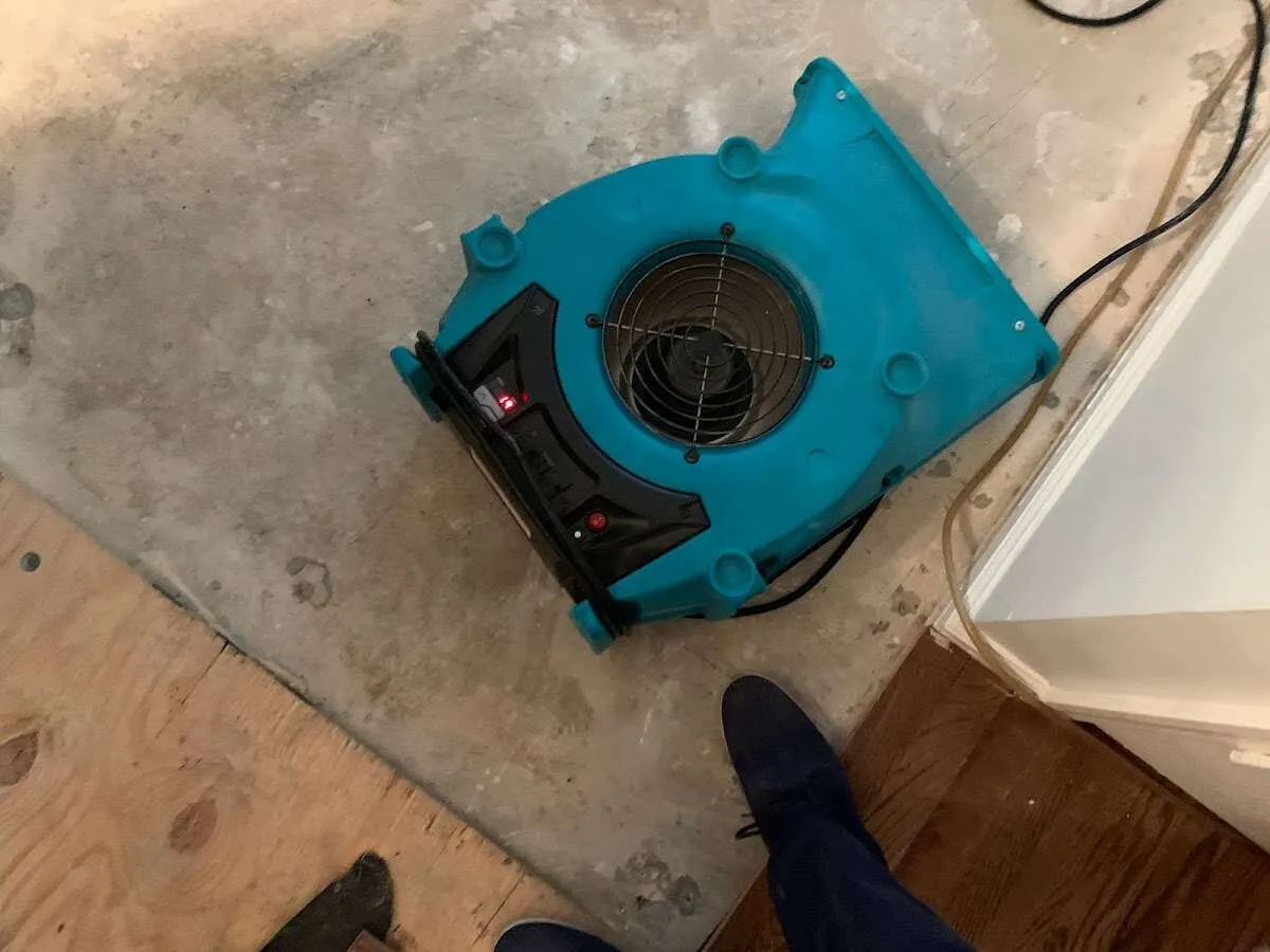 Air mover drying subfloor during Commercial Water Damage Restoration in Desert Palms